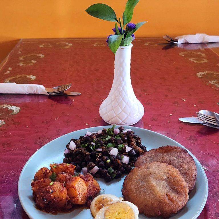 Traditional Nepalese plate with pakora and chutney