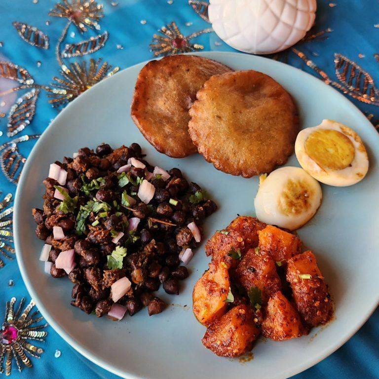 Colorful appetizer plate with samosas and salad